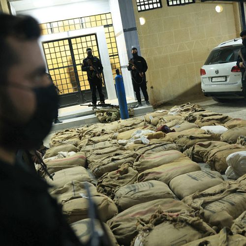 Syrian security forces display at their headquarters in Damascus on October 21, 2025 around 12 million captagon stimulant pills and 500 kgs of hashish, seized from traffickers near the Syrian capital. Syria's interior ministry said on October 20 it seized about 12 million captagon pills in a raid on a drug smuggling network operating near Damascus. The seizure marks one of the largest drug busts since the transitional authority assumed power in late 2024. (Photo by Bakr ALkasem / AFP) (Photo by BAKR ALKASEM/AFP via Getty Images)