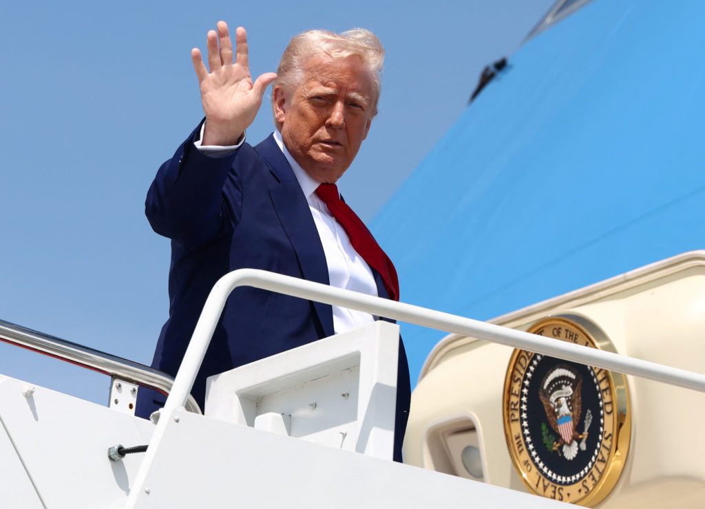 U.S. President Donald Trump boards Air Force One as he departs for Michigan to attend a rally to celebrate his first 100 days in office, at Joint Base Andrews in Maryland, U.S., April 29, 2025. REUTERS/Evelyn Hockstein